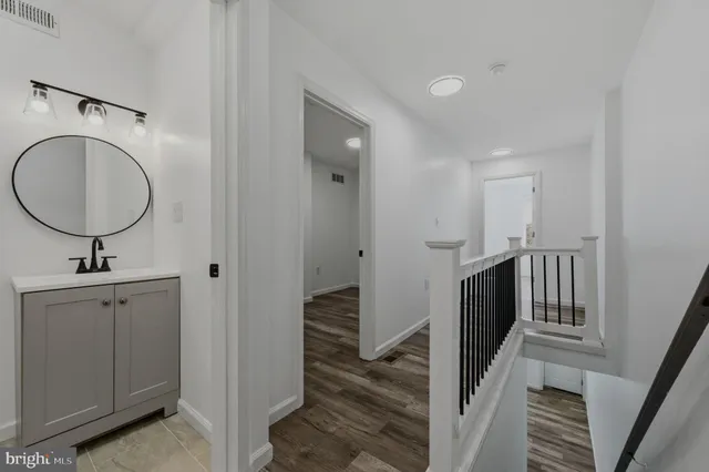 a view of a hallway with washer and dryer