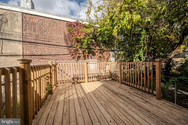 a view of a balcony with wooden floor