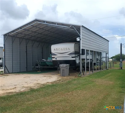 a view of a backyard of the house