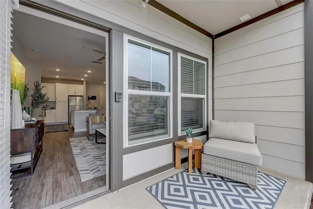 a front view of a residential apartment building with a yard