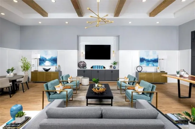 a view of a livingroom with furniture and an empty room