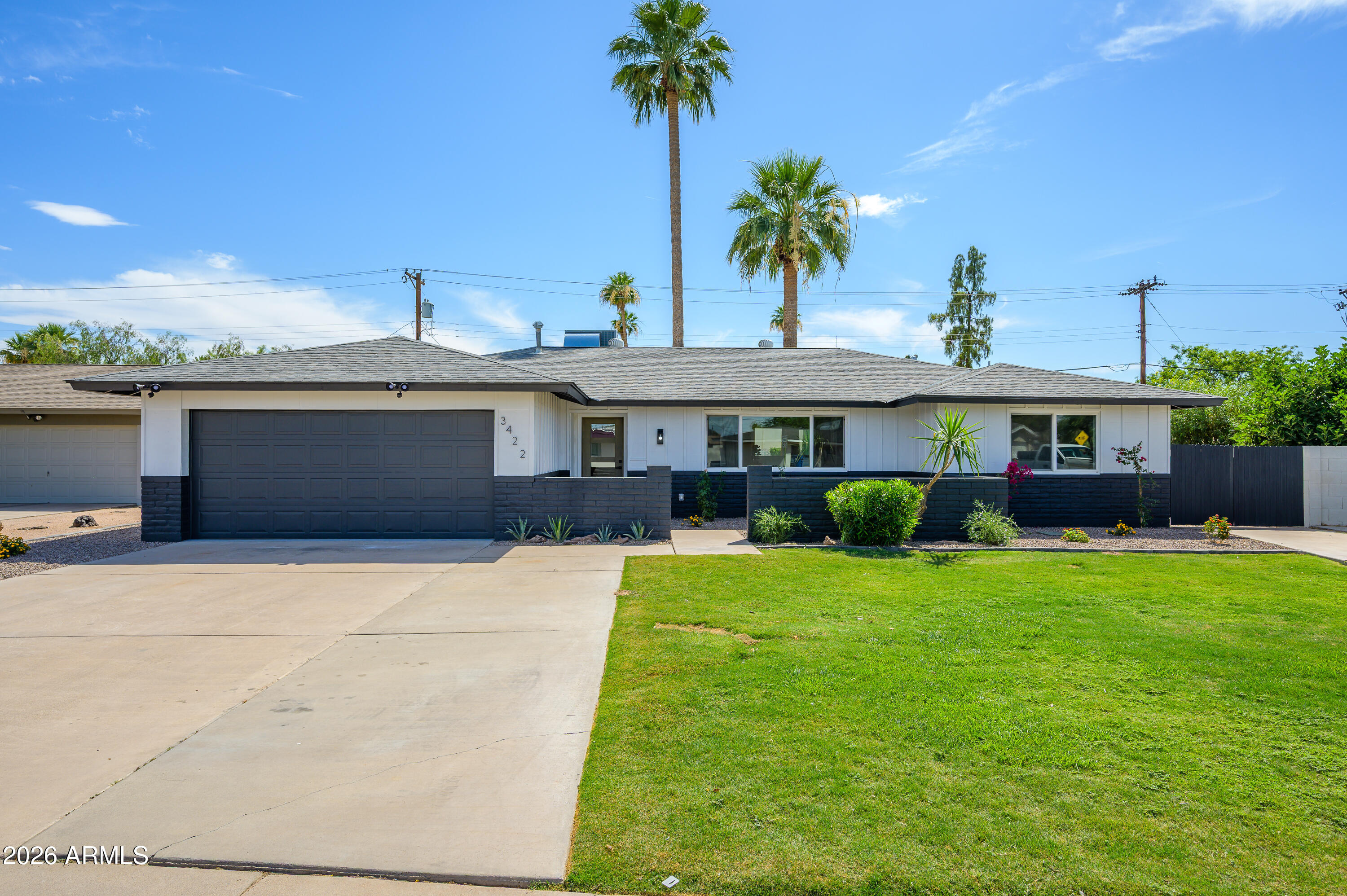 3422 South Terrace Road Tempe, AZ 85282 - Photo 36 of 43 a front view of a house with a garden and yard