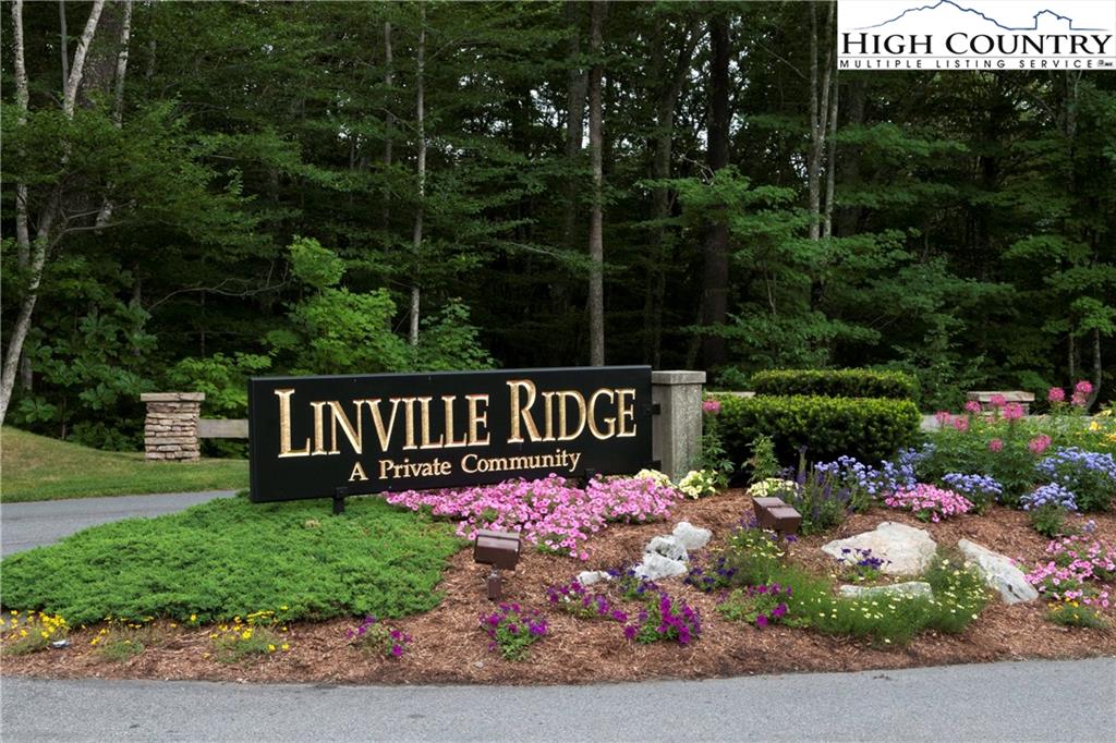 602 Ridge Run Linville, NC 28646 - Photo 1 of 11 a sign that is sitting in front of flowers