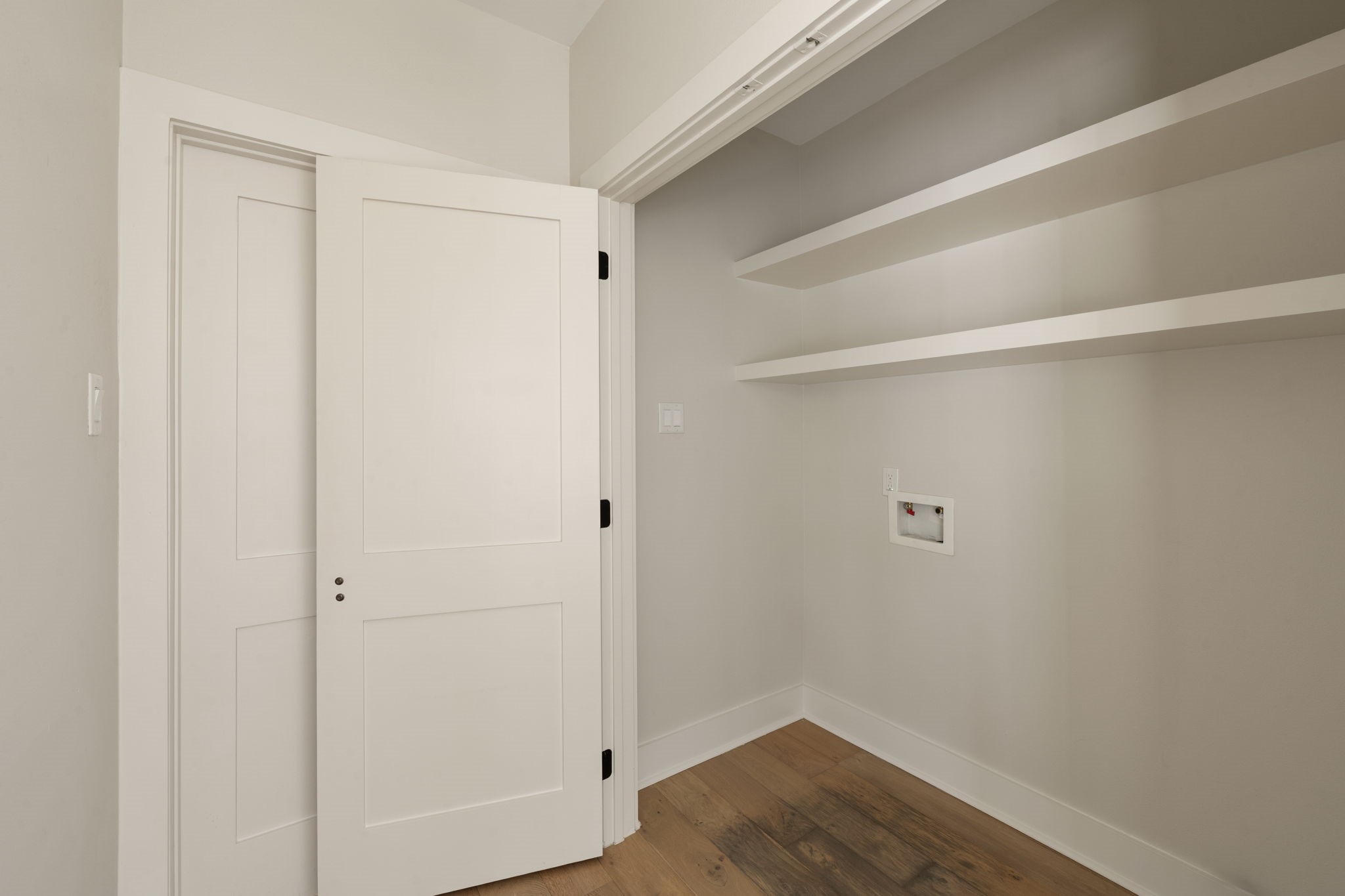 1022 Key Street Houston, TX 77009 - Photo 24 of 30 An in home laundry room with additional storage is located between the bedrooms.