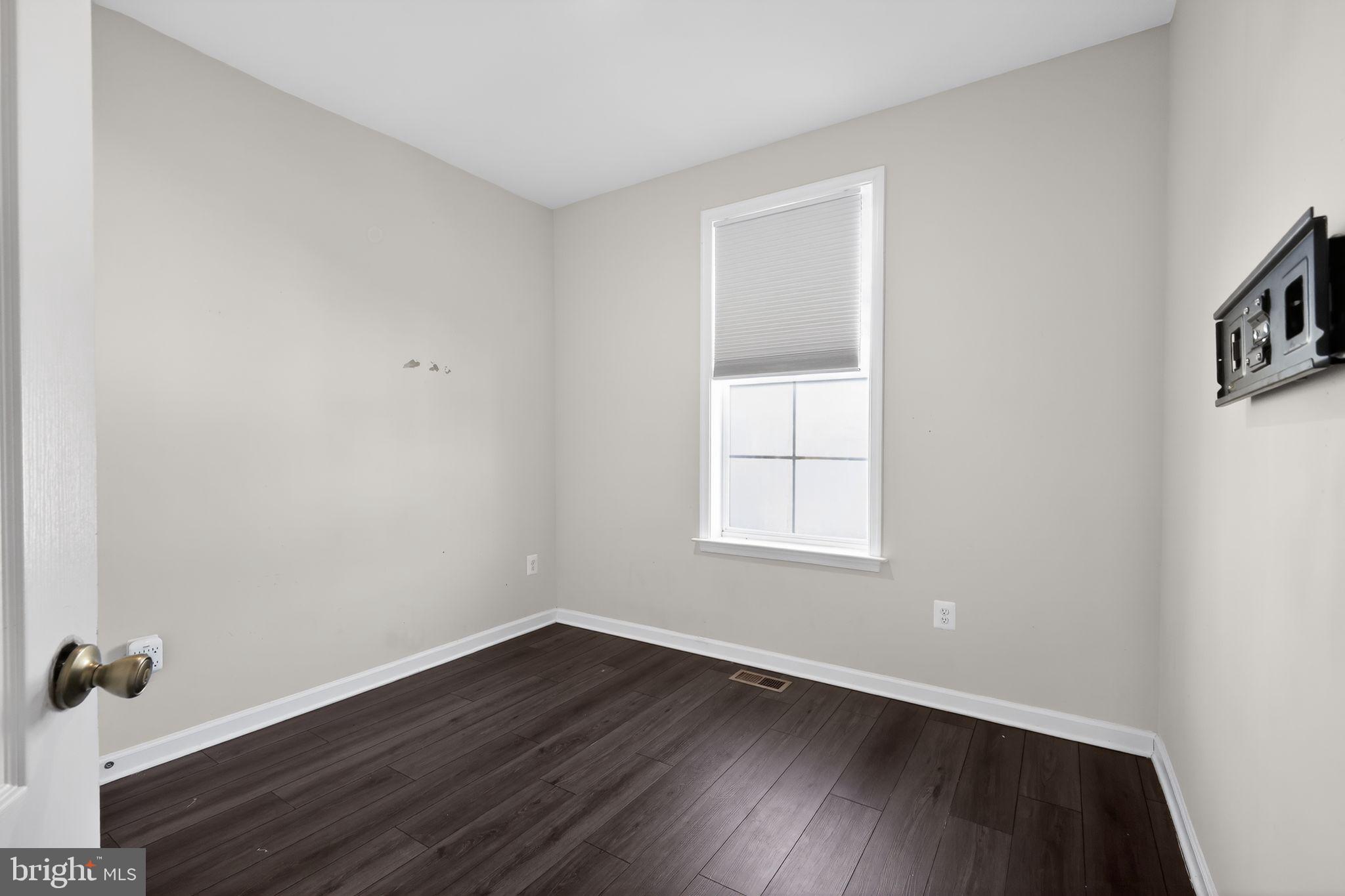 1027 Overlook Way Laurel, MD 20707 - Photo 14 of 30 an empty room with wooden floor and windows