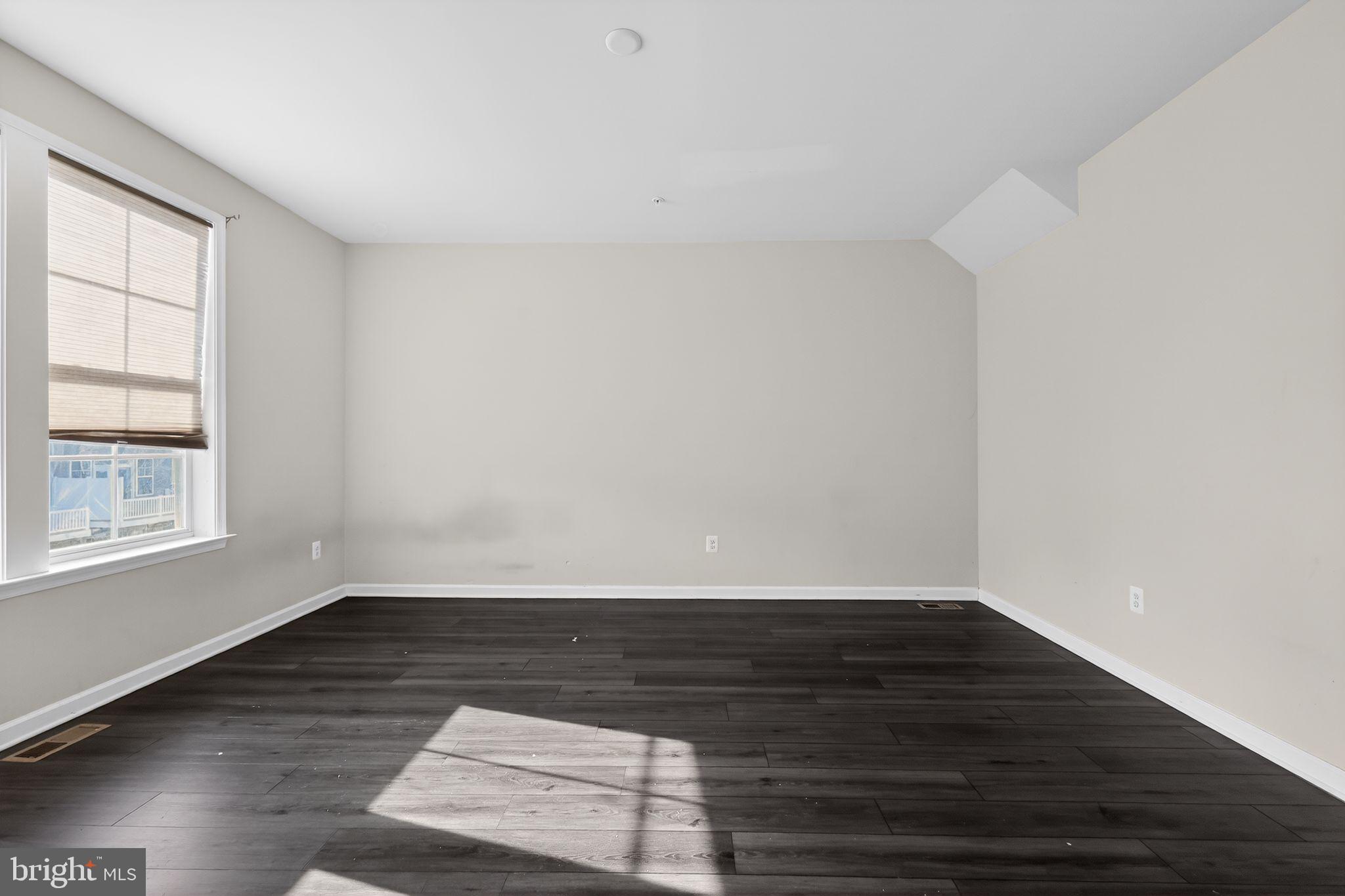 1027 Overlook Way Laurel, MD 20707 - Photo 15 of 30 an empty room with wooden floor and windows