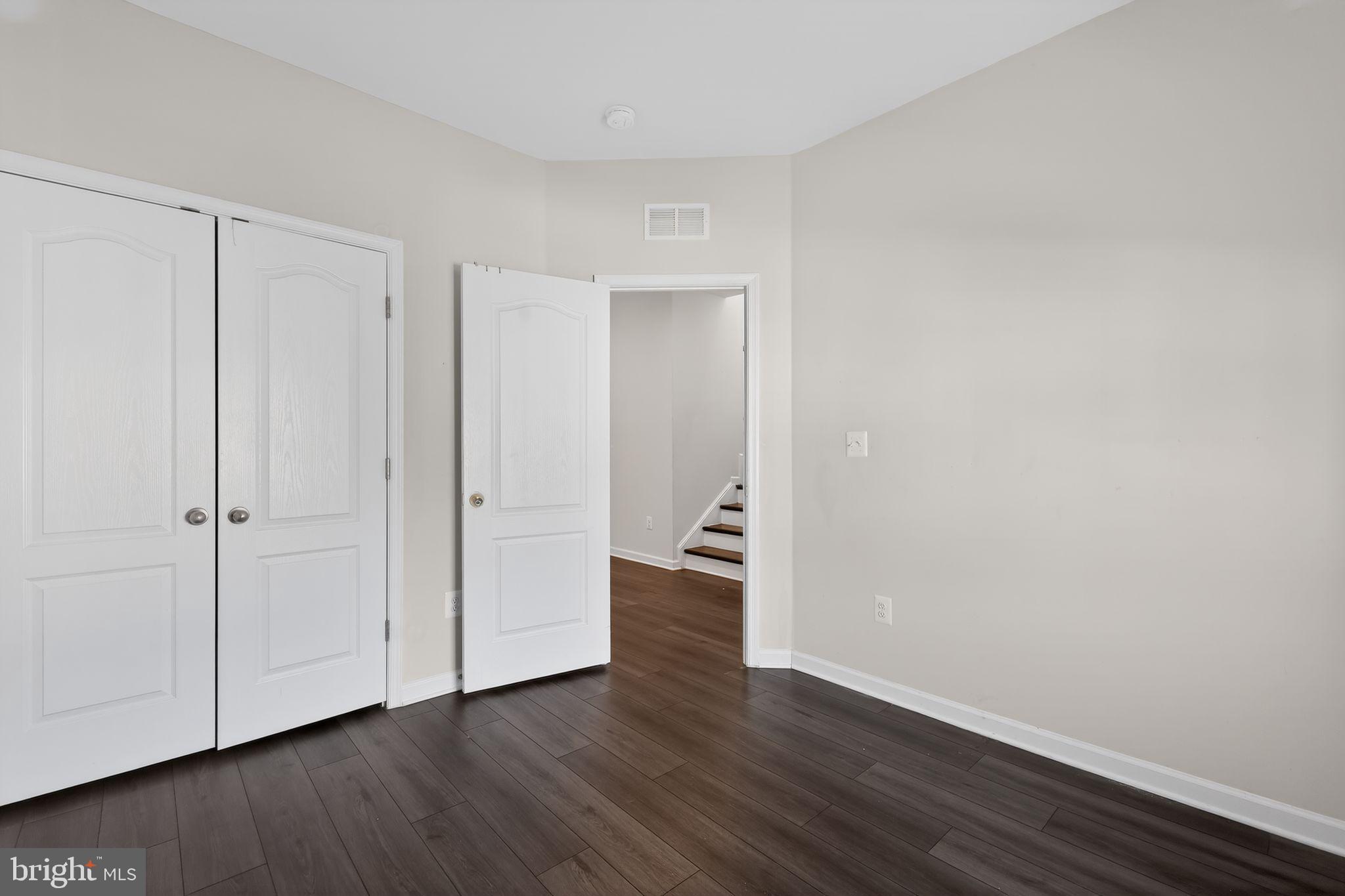 1027 Overlook Way Laurel, MD 20707 - Photo 16 of 30 a view of an empty room with wooden floor