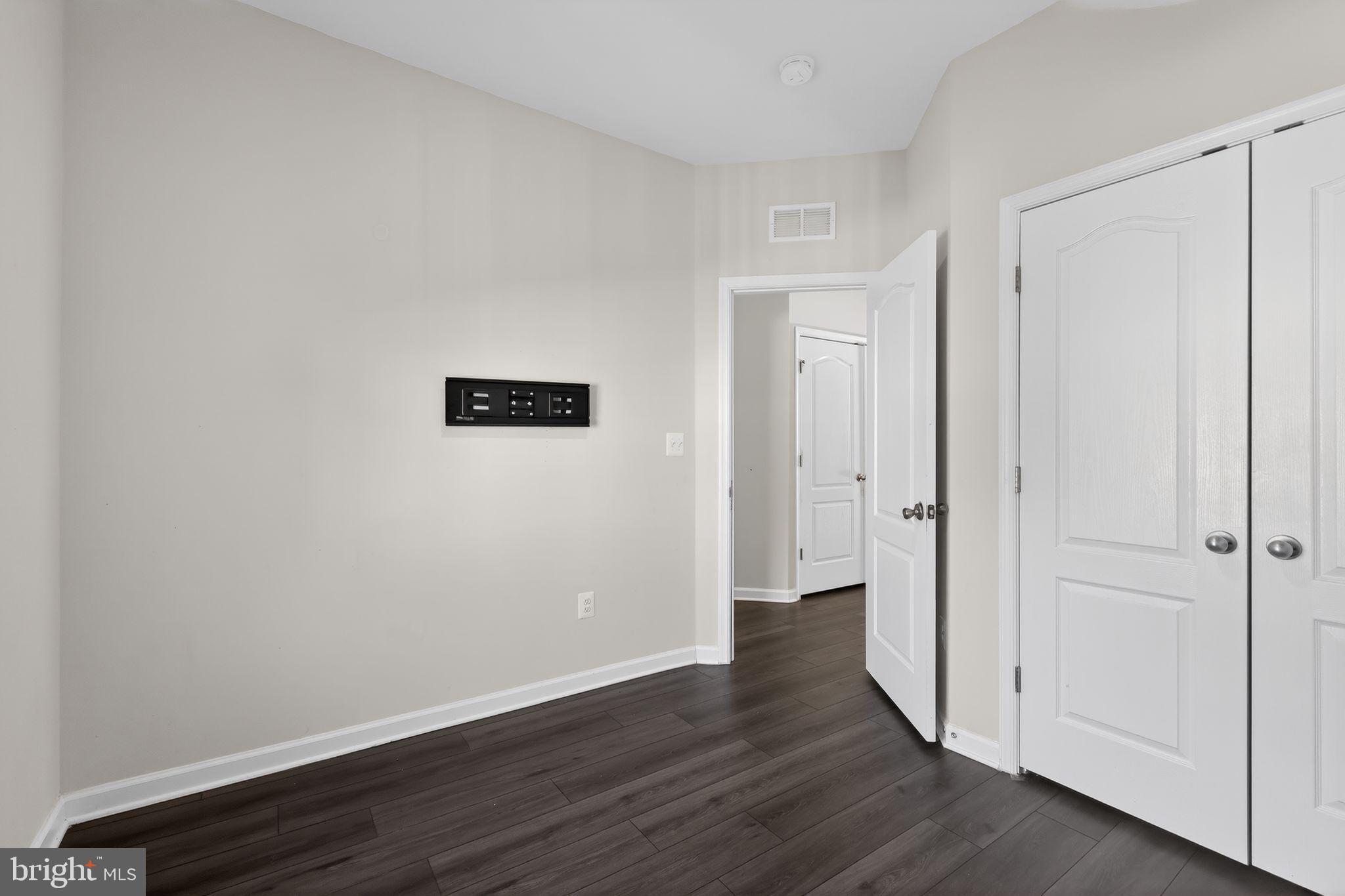 1027 Overlook Way Laurel, MD 20707 - Photo 19 of 30 a view of an empty room with wooden floor