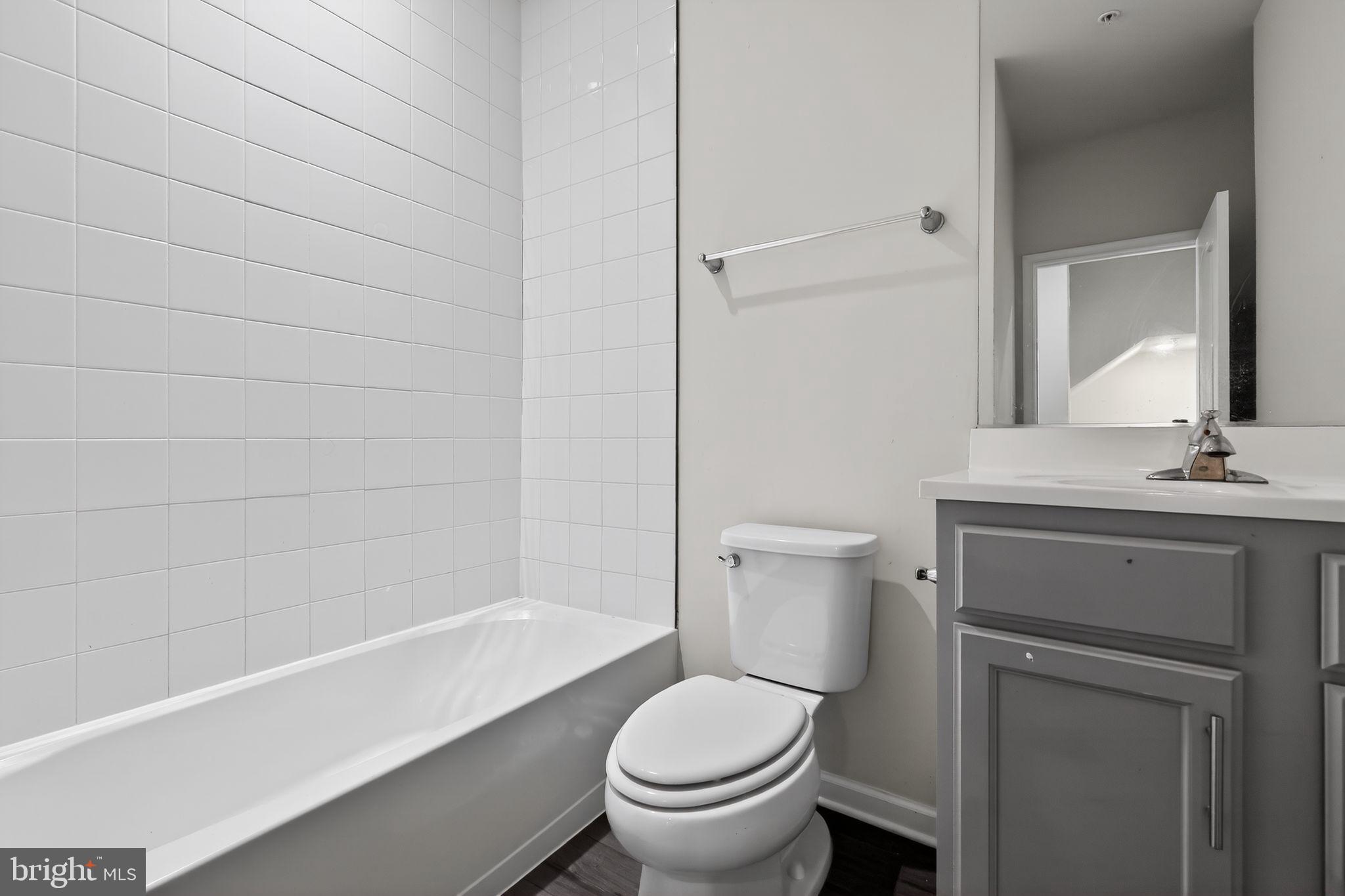 1027 Overlook Way Laurel, MD 20707 - Photo 22 of 30 a bathroom with a sink a toilet and shower