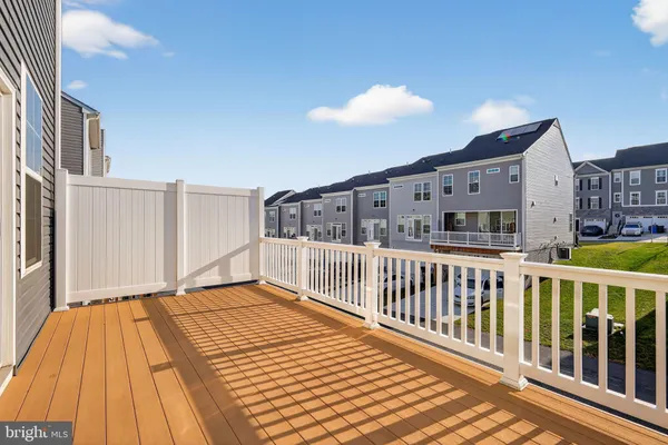 a view of a balcony with wooden floor