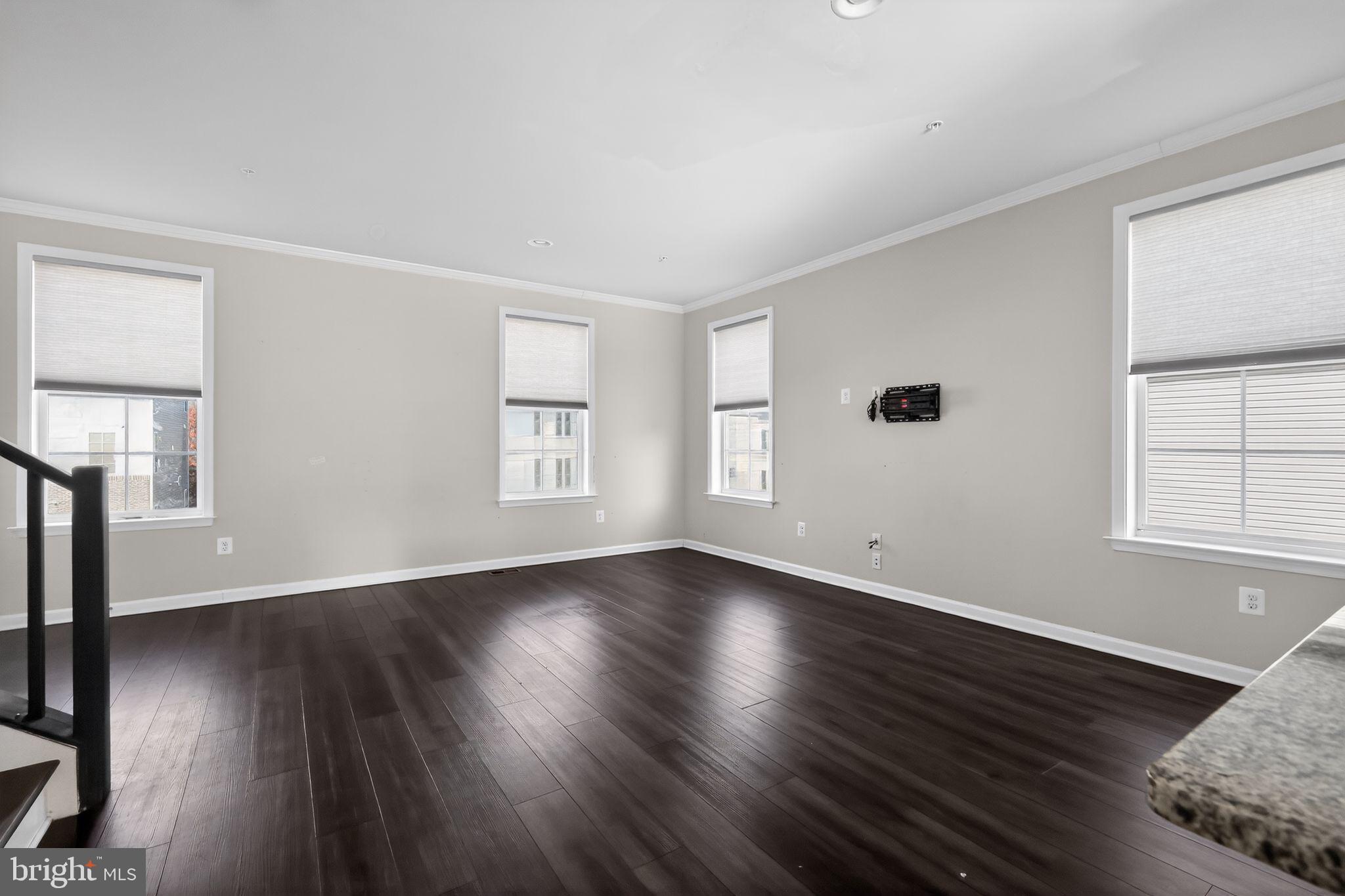 1027 Overlook Way Laurel, MD 20707 - Photo 5 of 30 a view of an empty room with wooden floor and a window