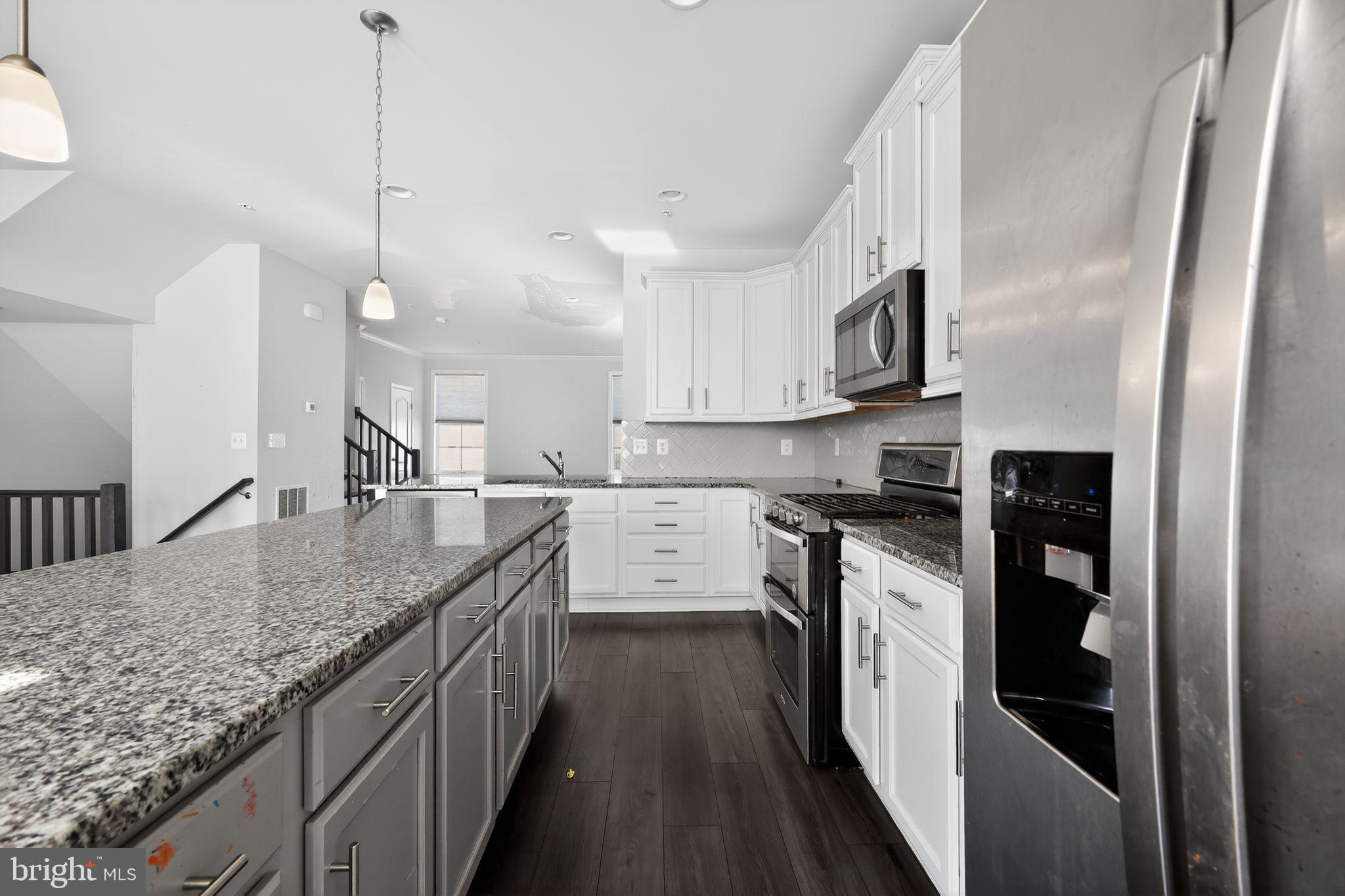 1027 Overlook Way Laurel, MD 20707 - Photo 8 of 30 a kitchen with stainless steel appliances granite countertop a sink a stove and a refrigerator