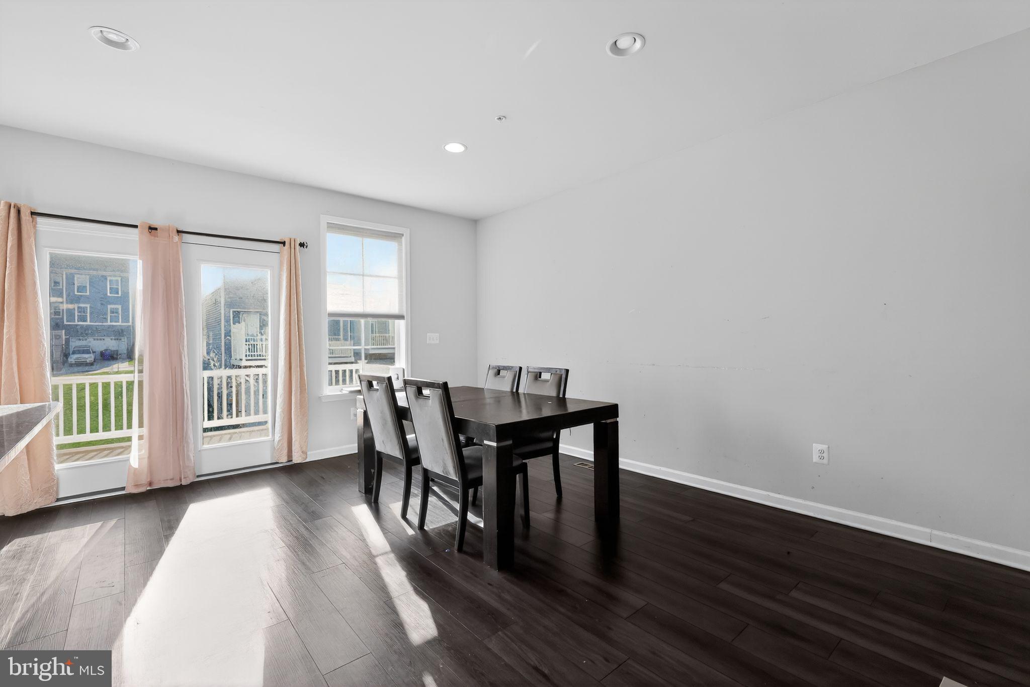1027 Overlook Way Laurel, MD 20707 - Photo 9 of 30 a view of a dining room with furniture and wooden floor