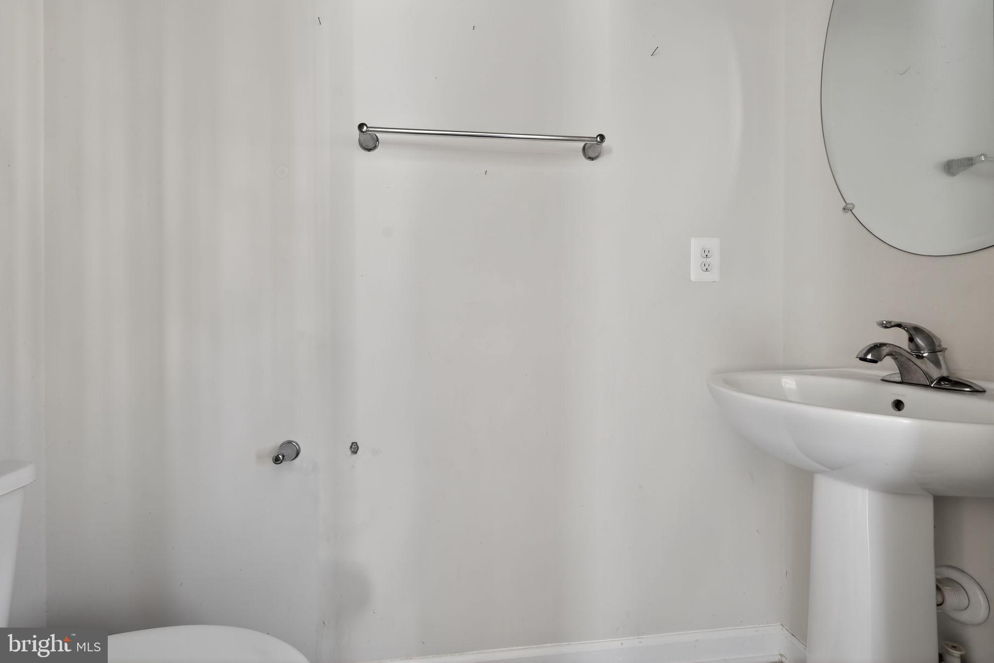 1027 Overlook Way Laurel, MD 20707 - Photo 10 of 30 a bathroom with a sink a toilet and shower