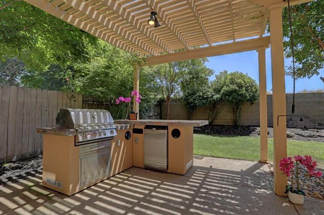 8916 Visage Circle Fair Oaks, CA 95628 - Photo 12 of 15 a view of a patio with table and chairs potted plants
