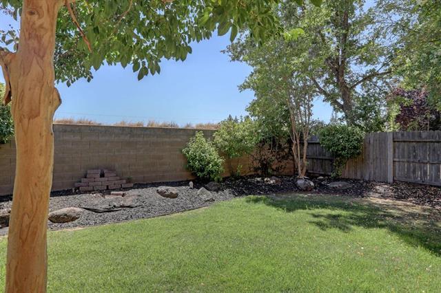 8916 Visage Circle Fair Oaks, CA 95628 - Photo 14 of 15 a backyard of a house with table and chairs