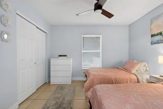 a bedroom with two beds and painted walls