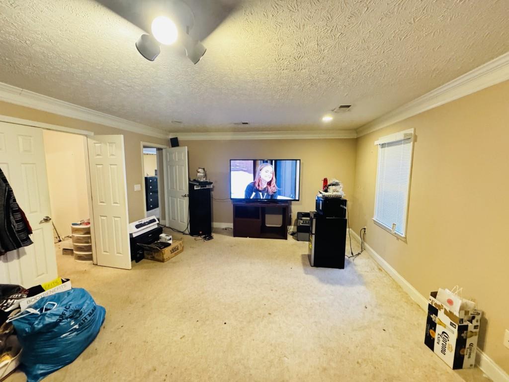 2359 Valley Way Snellville, GA 30078 - Photo 11 of 26 a room with furniture and a flat screen tv