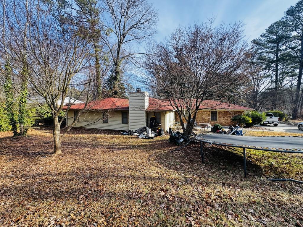 2359 Valley Way Snellville, GA 30078 - Photo 23 of 26 a view of a yard with a tree