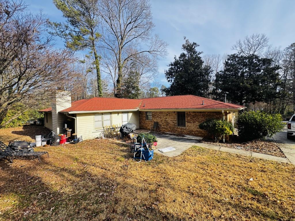 2359 Valley Way Snellville, GA 30078 - Photo 24 of 26 a view of a park with table and chairs under an umbrella