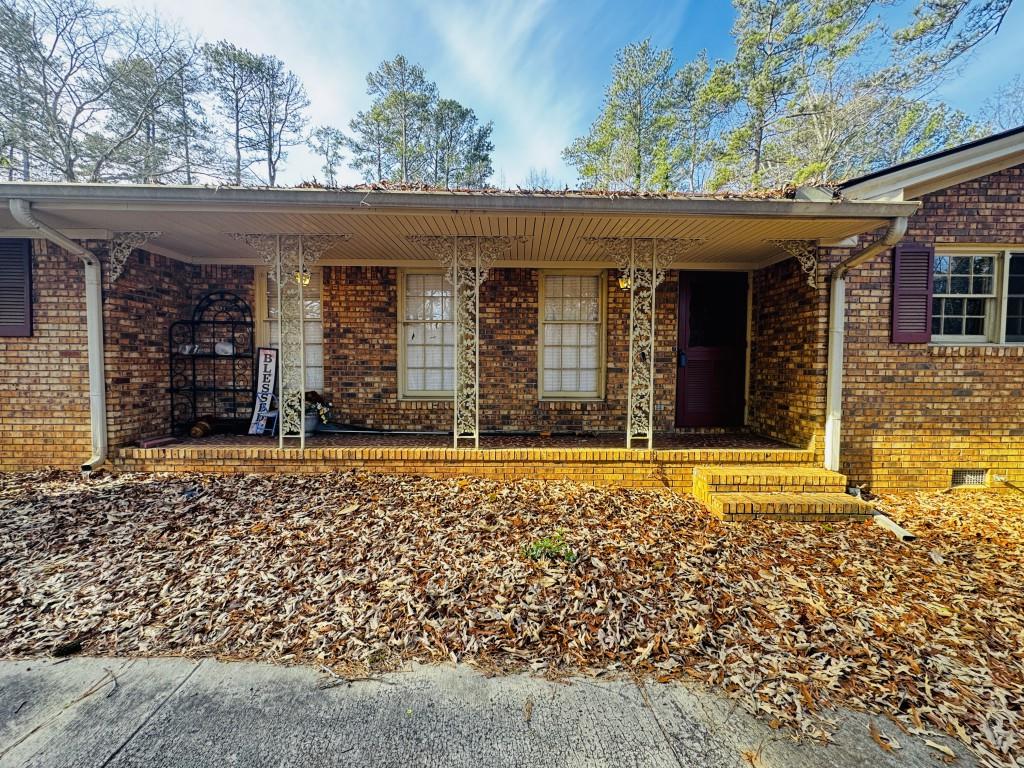 2359 Valley Way Snellville, GA 30078 - Photo 3 of 26 front view of a brick house with a yard