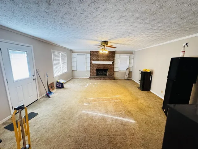 a bed room with a bed furniture and a flat screen tv