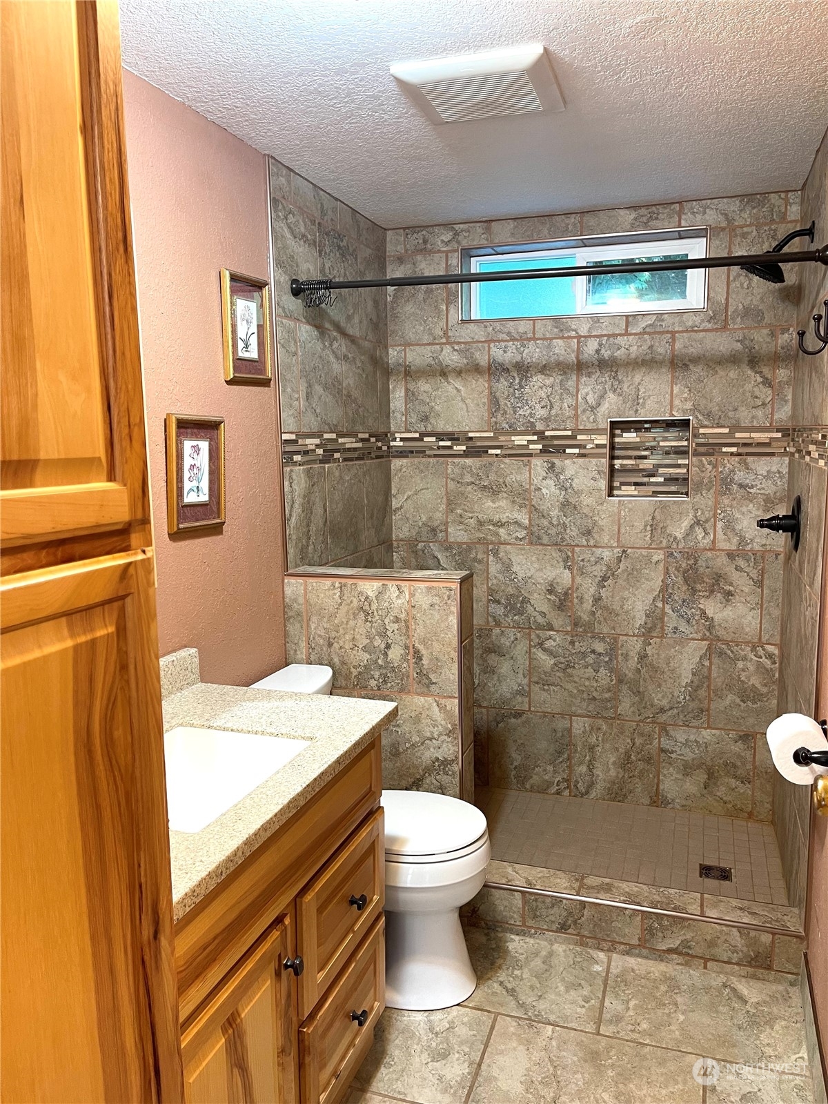 2090 Anderson Lake Road Chimacum, WA 98325 - Photo 15 of 25 a bathroom with a shower toilet and sink
