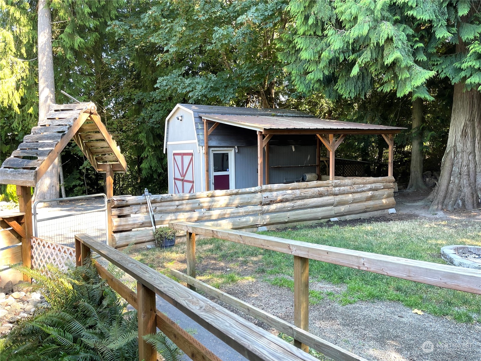 2090 Anderson Lake Road Chimacum, WA 98325 - Photo 20 of 25 a view of a house with backyard and sitting area
