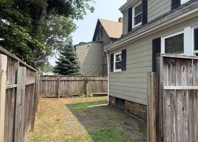 a view of a back yard of the house