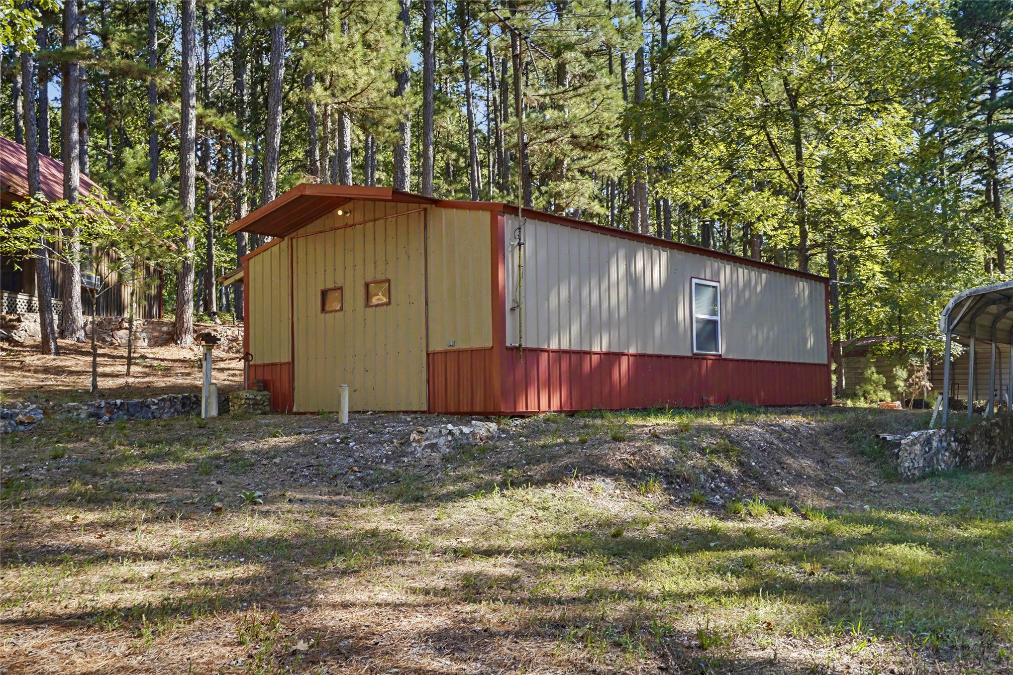 46420 South 590 Road Jay, OK 74346 - Photo 23 of 63 Corrugated metal exterior with a red and beige color scheme