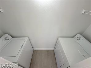 7255 West Sunset Road, Unit 2046 Las Vegas, NV 89113 - Photo 23 of 28 Functional laundry space features side-by-side washer and dryer units for effortless chores.