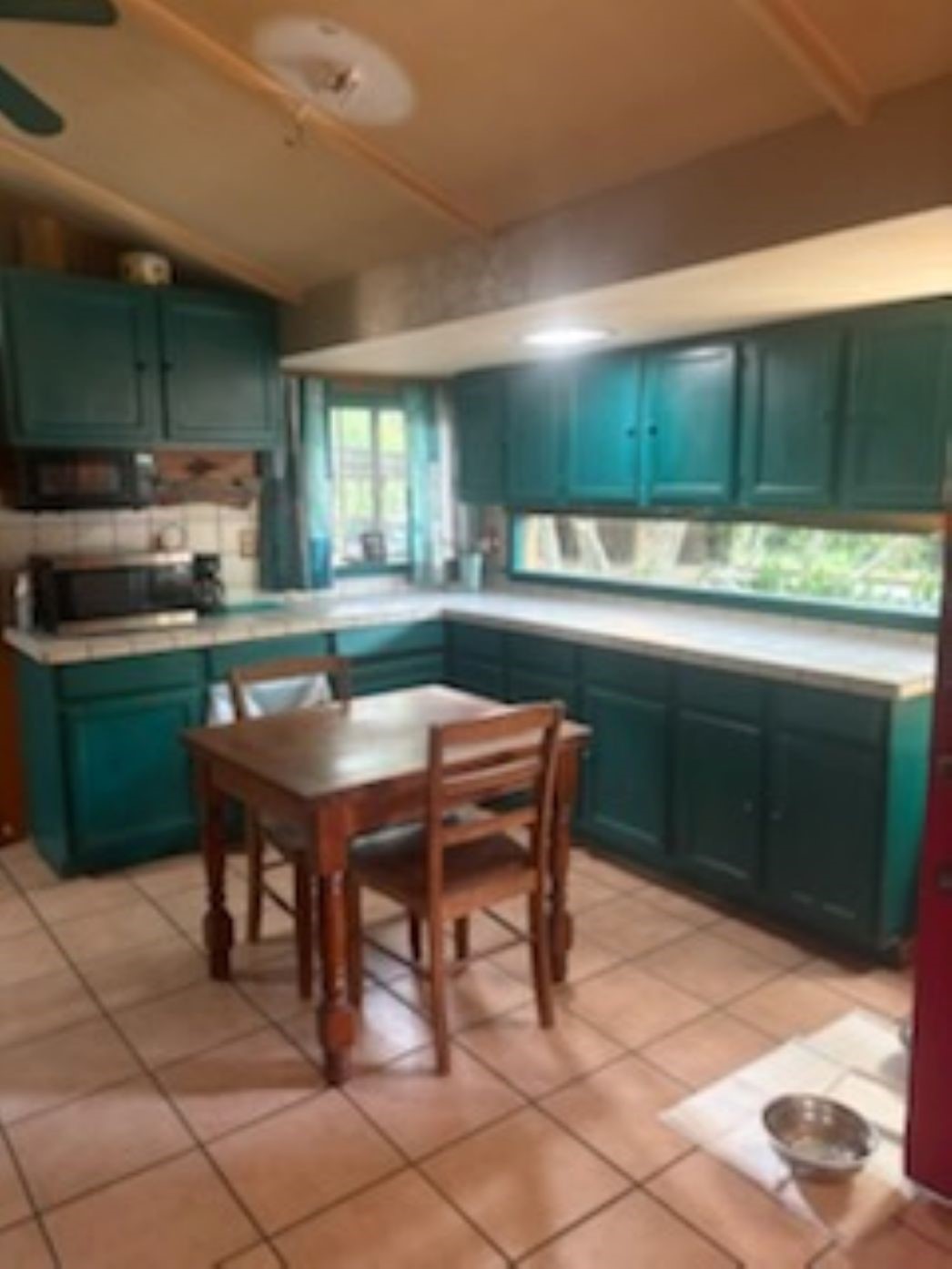 12505 Rollingwood Loop Conroe, TX 77303 - Photo 13 of 24 a kitchen with a table and chairs in it