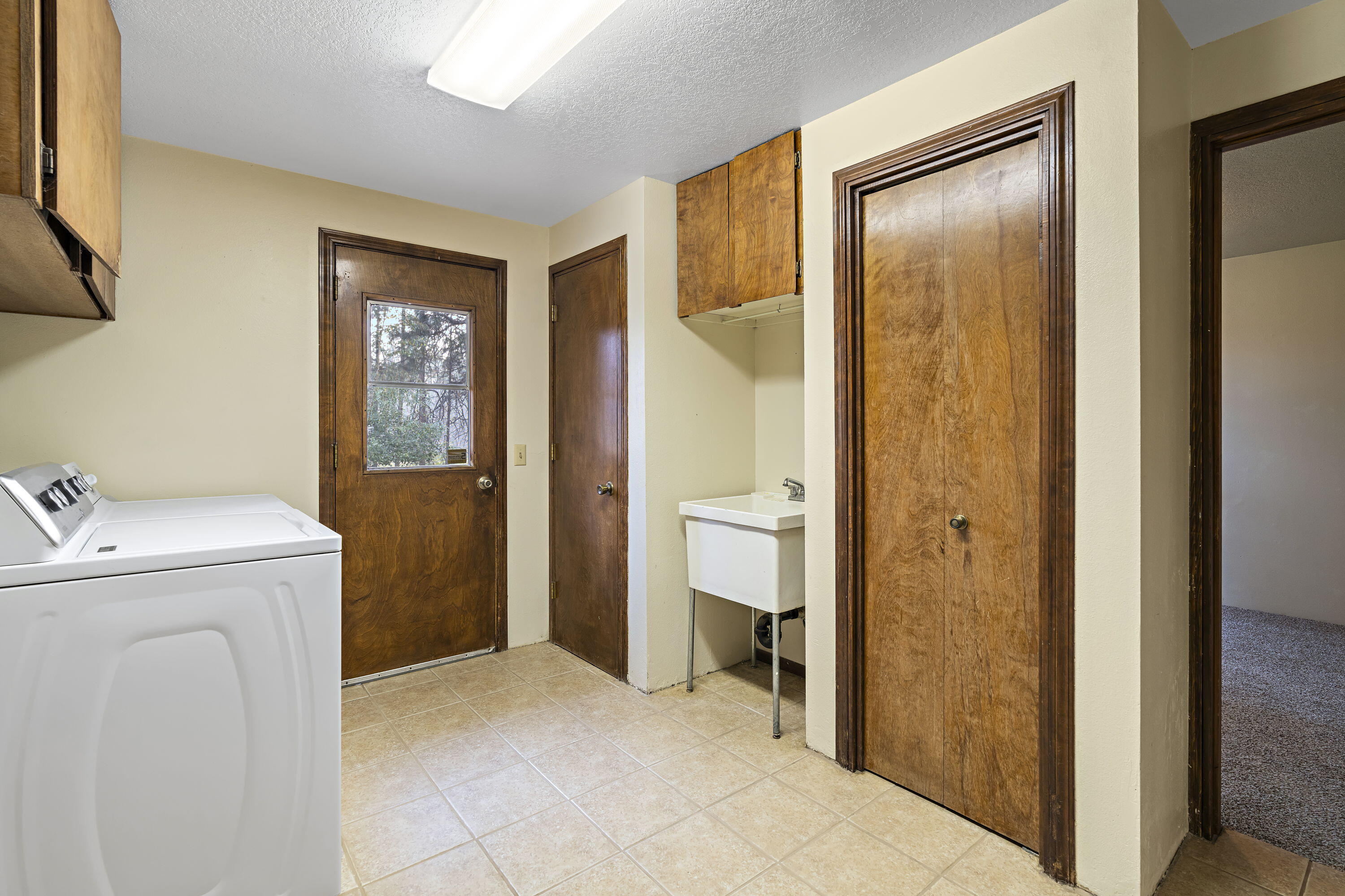 17315 Elsinore Road Bend, OR 97707 - Photo 12 of 41 12. Laundry Room with Door to Back Patio