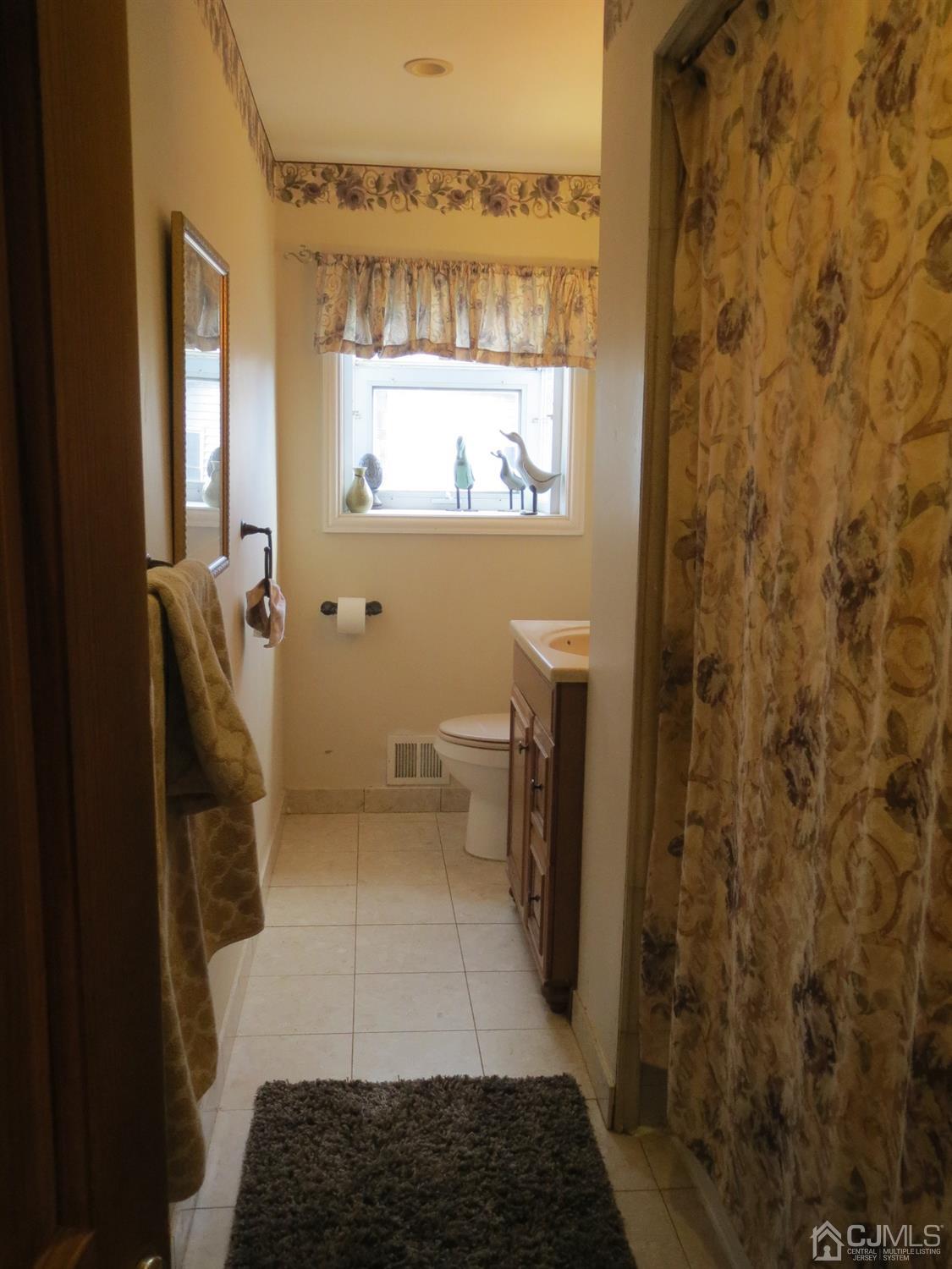 43 Princeton Road Old Bridge, NJ 08859 - Photo 12 of 26 a bathroom with a sink a toilet and a shower