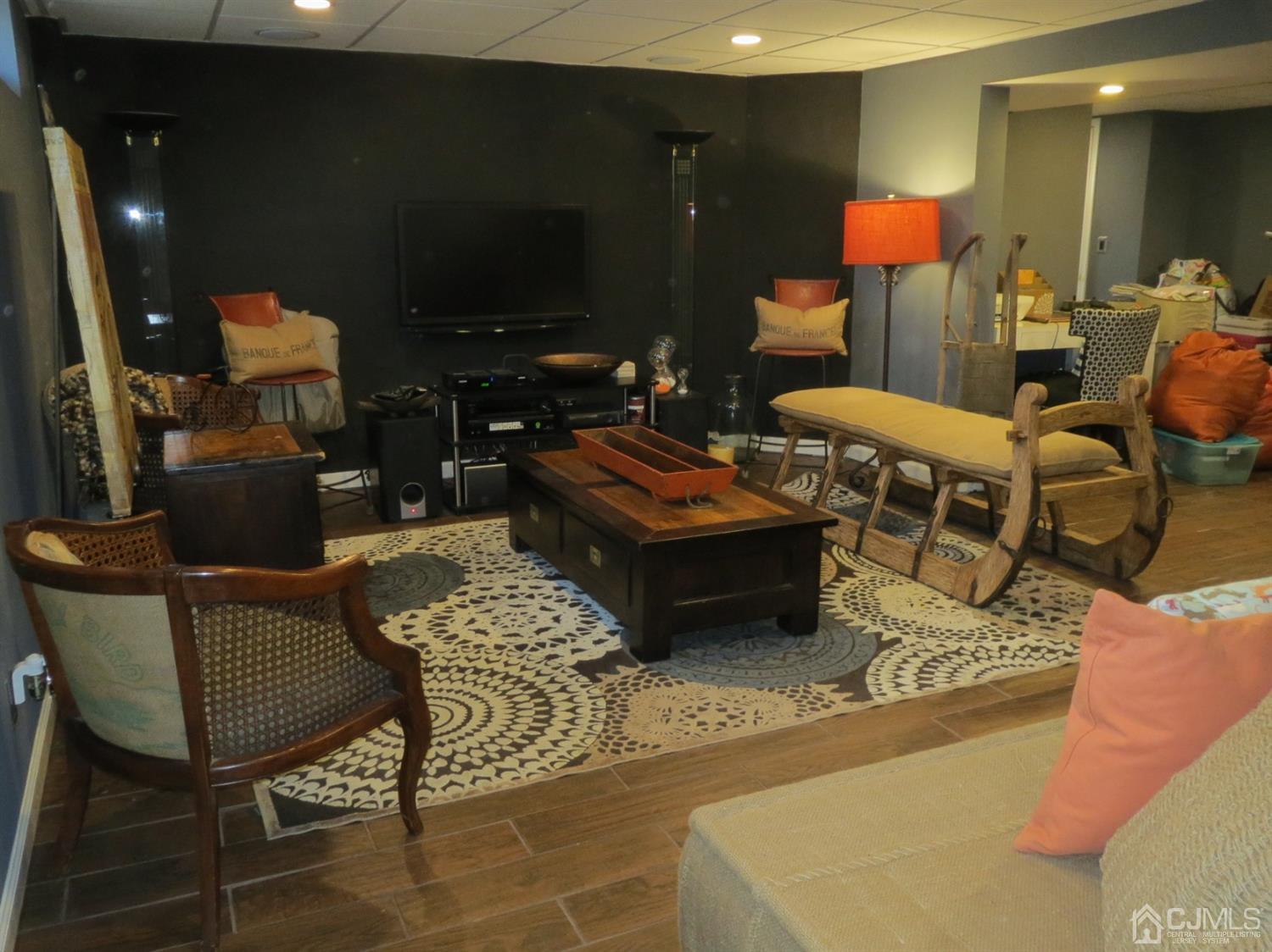 43 Princeton Road Old Bridge, NJ 08859 - Photo 15 of 26 a living room with furniture and a fireplace