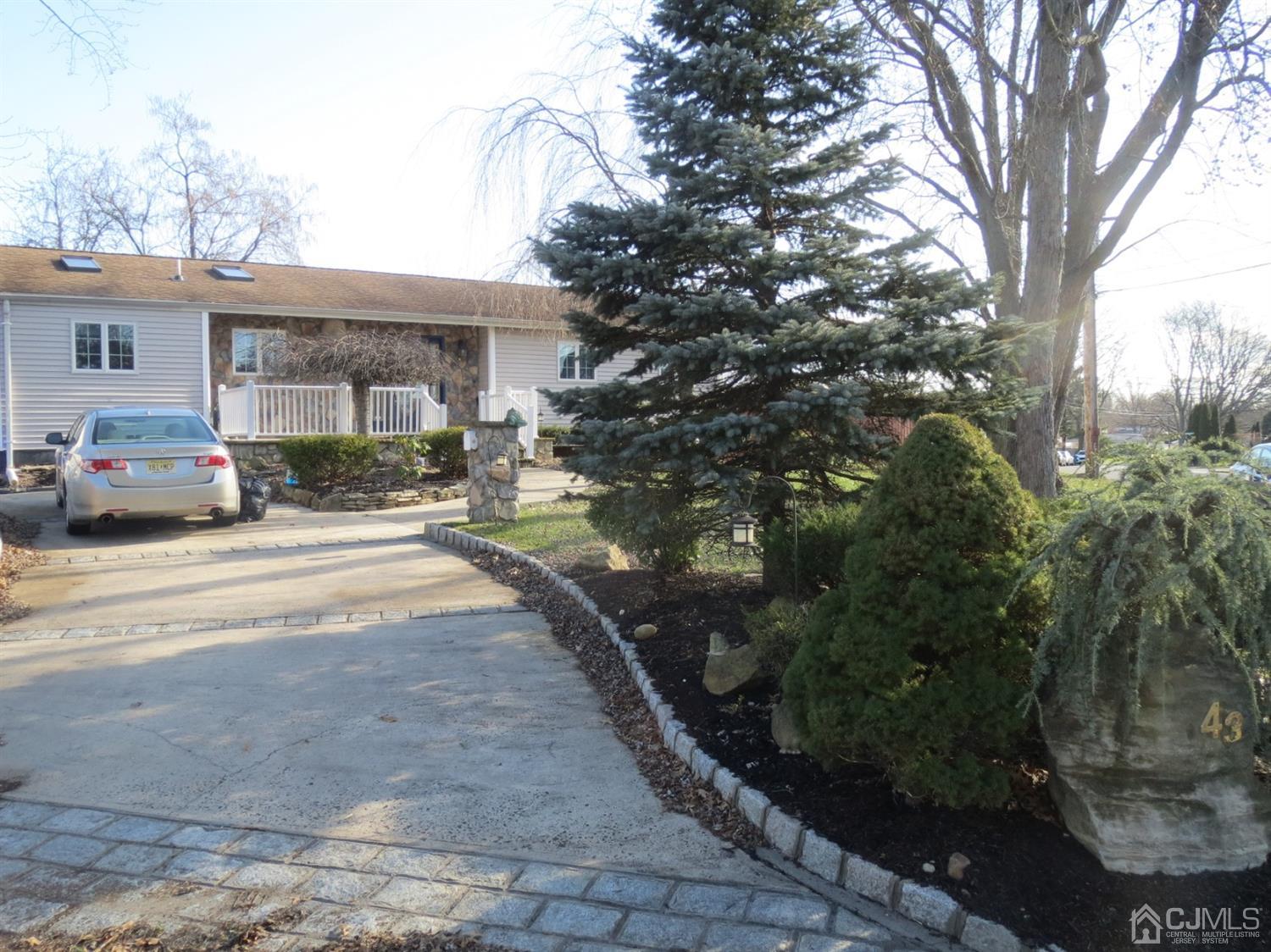 43 Princeton Road Old Bridge, NJ 08859 - Photo 19 of 26 a front view of a house with a yard and trees
