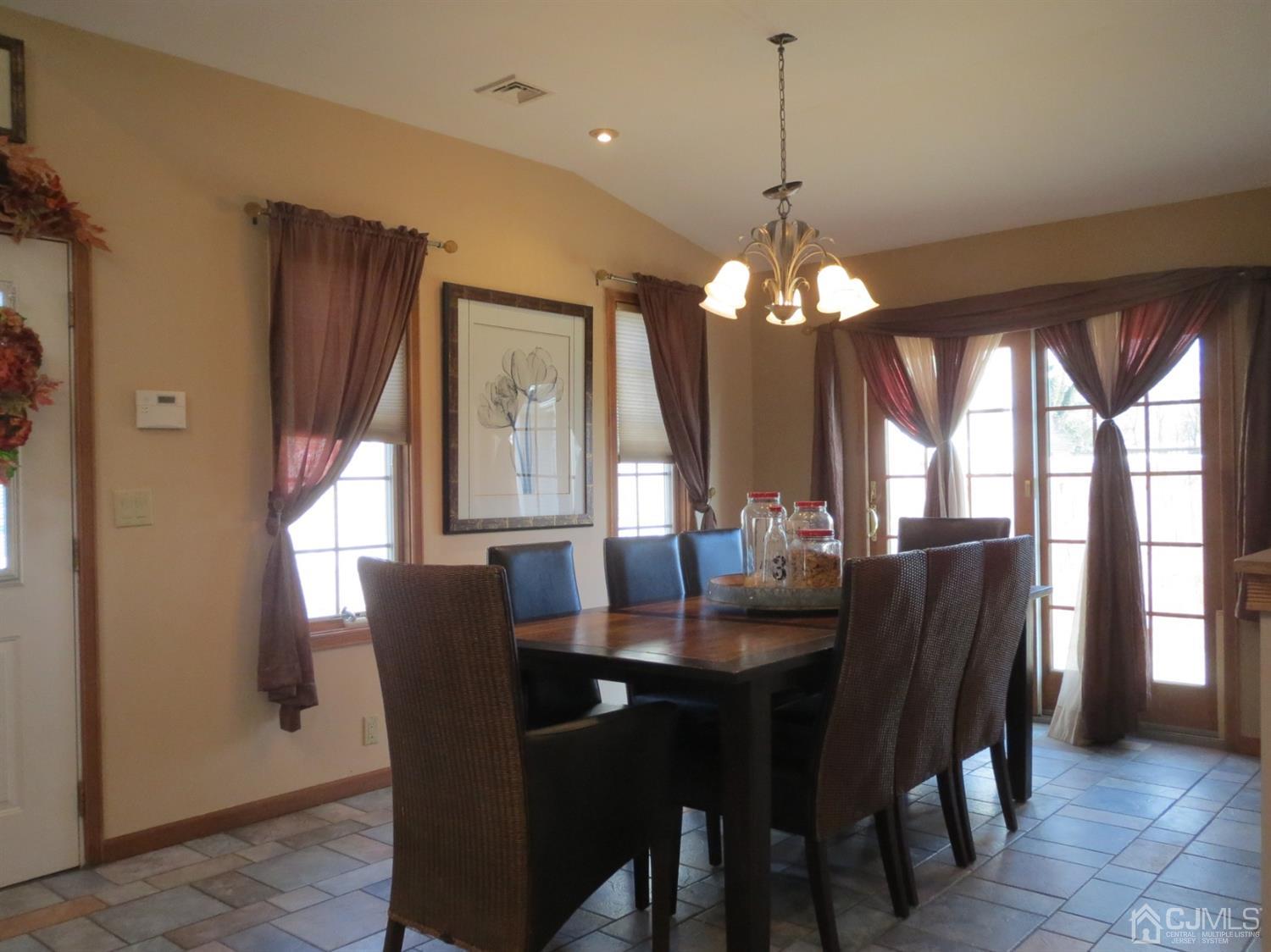 43 Princeton Road Old Bridge, NJ 08859 - Photo 4 of 26 a dining room with furniture a chandelier and window
