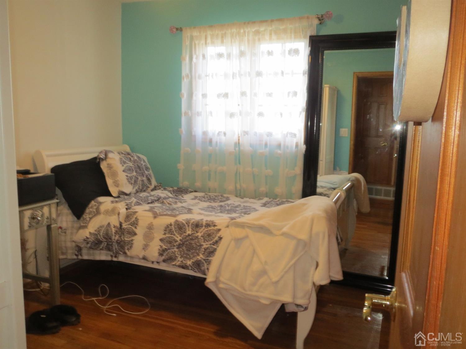 43 Princeton Road Old Bridge, NJ 08859 - Photo 9 of 26 a bedroom with a bed and a window
