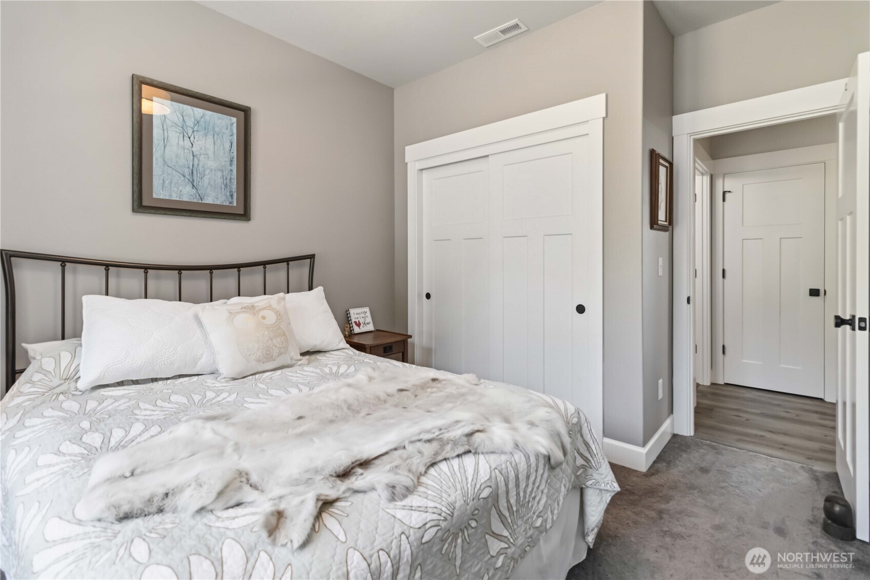 119 Old Mill Creek Road Longview, WA 98632 - Photo 16 of 40 a bedroom with a large bed and a painting on the wall