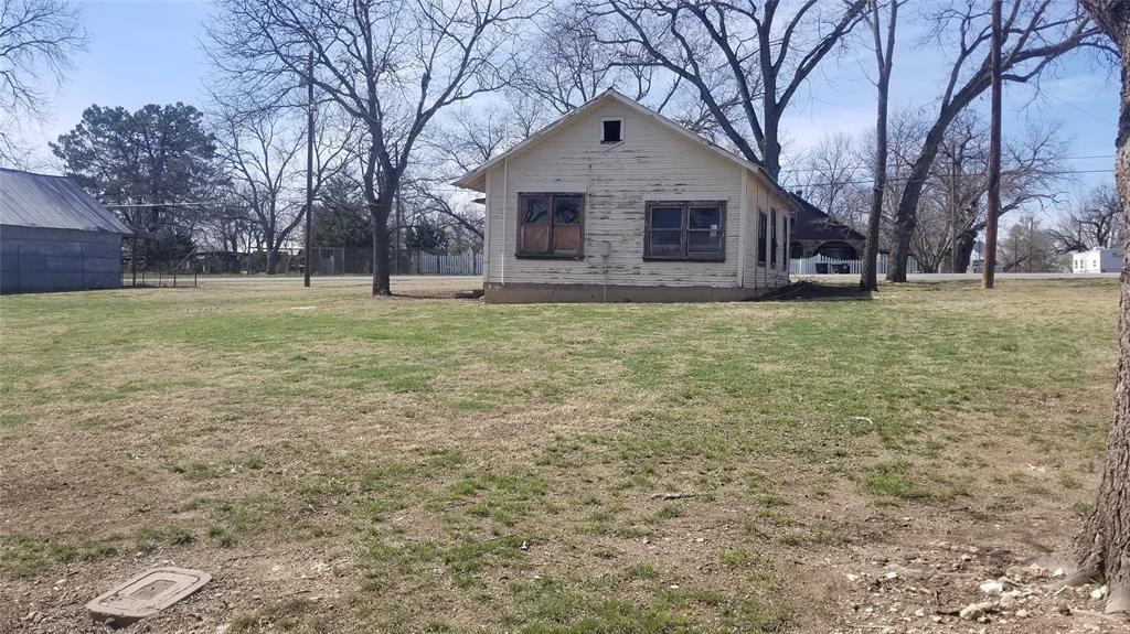 601 Main Street Blanket, TX 76432 - Photo 3 of 4 a front view of a house with a yard