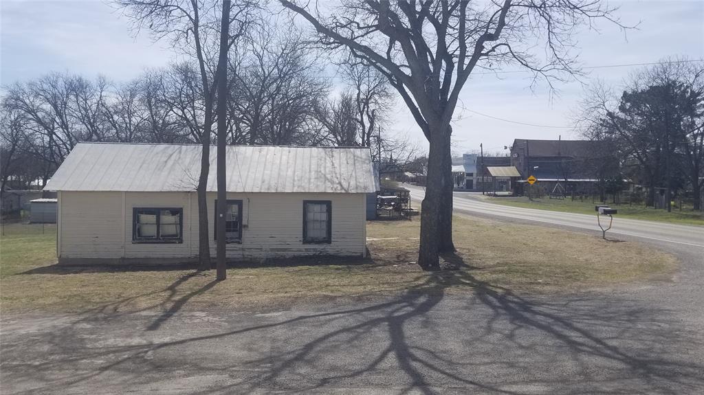 601 Main Street Blanket, TX 76432 - Photo 4 of 4 a view of a house with a yard and tree
