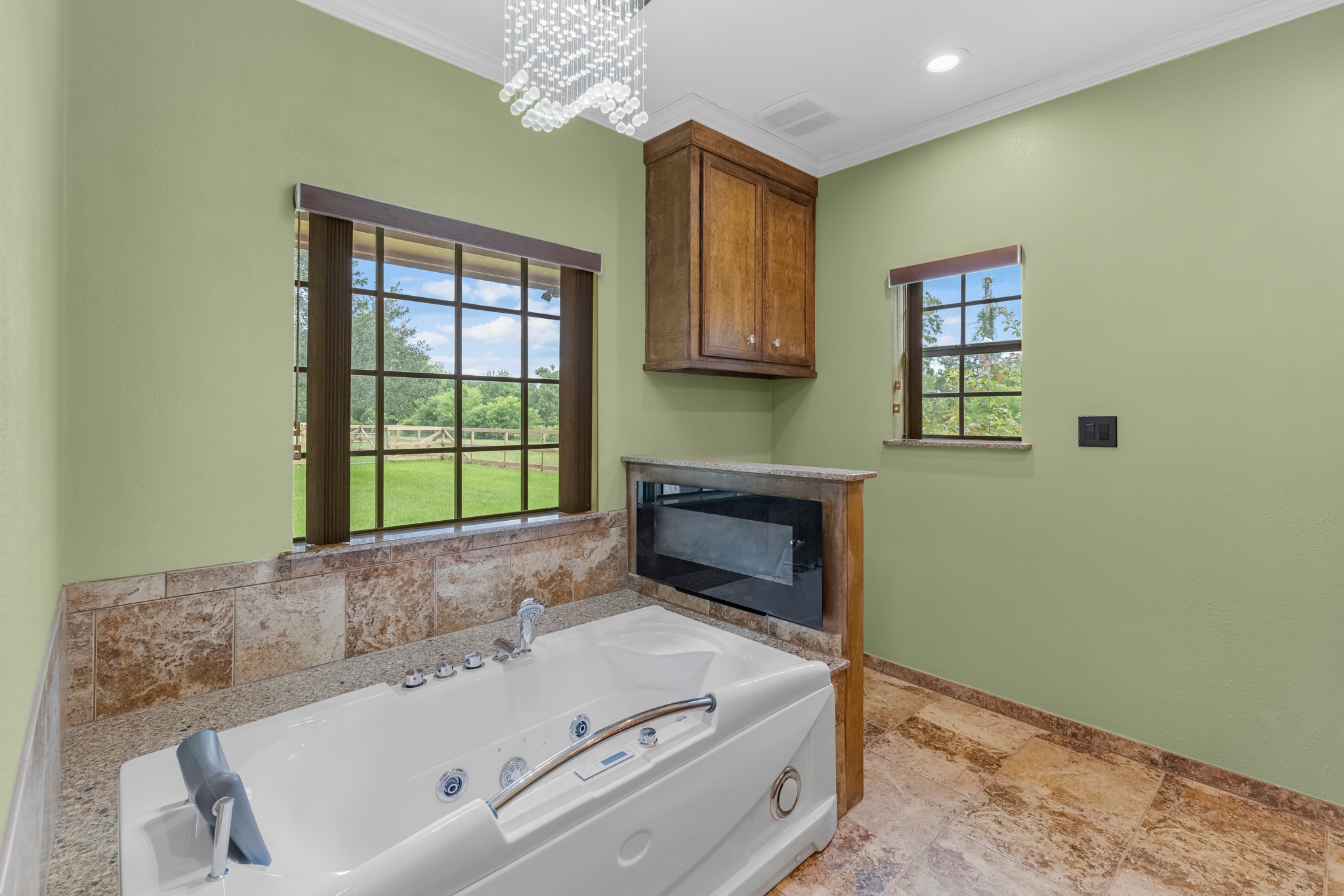 17126 County Road 39 Rosharon, TX 77583 - Photo 33 of 47 Jetted tub with UV in jets, in line heating, led lighting and many features on the fireplace as well.