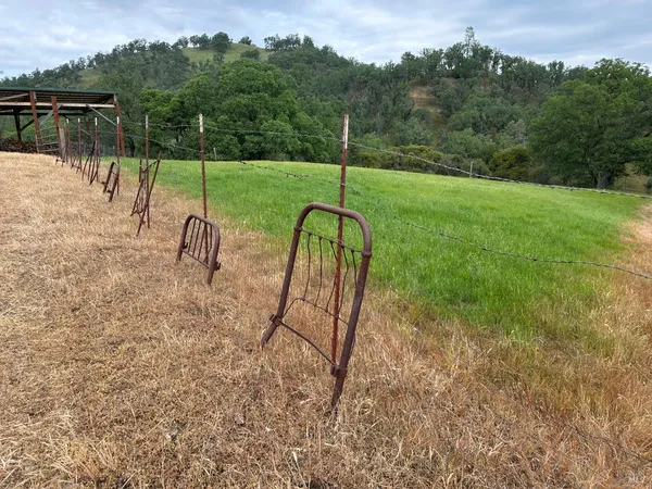 a backyard of a house with table and chairs