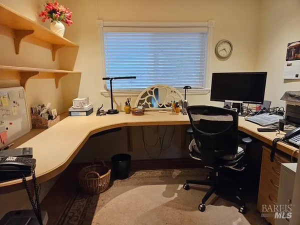 a view of a workspace with furniture