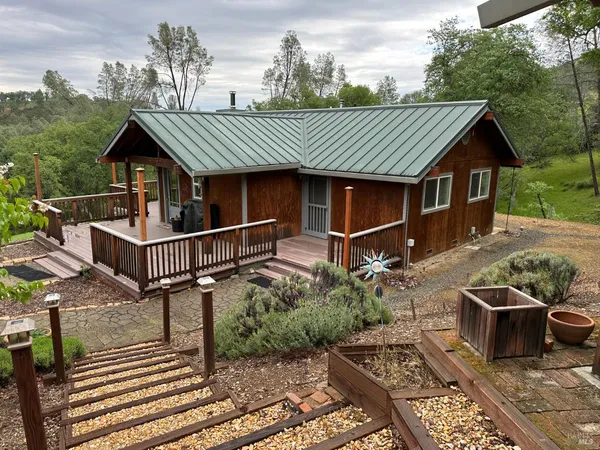 a view of a house with pool and wooden floor