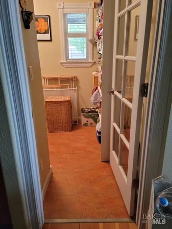 a view of a storage and utility room with a sink