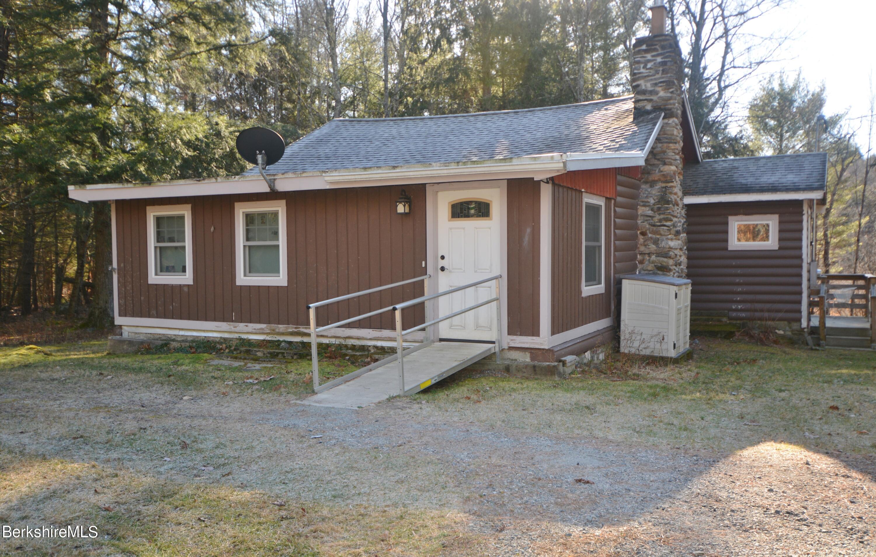 150 Cold Spring Road Sandisfield, MA 01255 - Photo 1 of 9 a view of a house with a yard and large tree