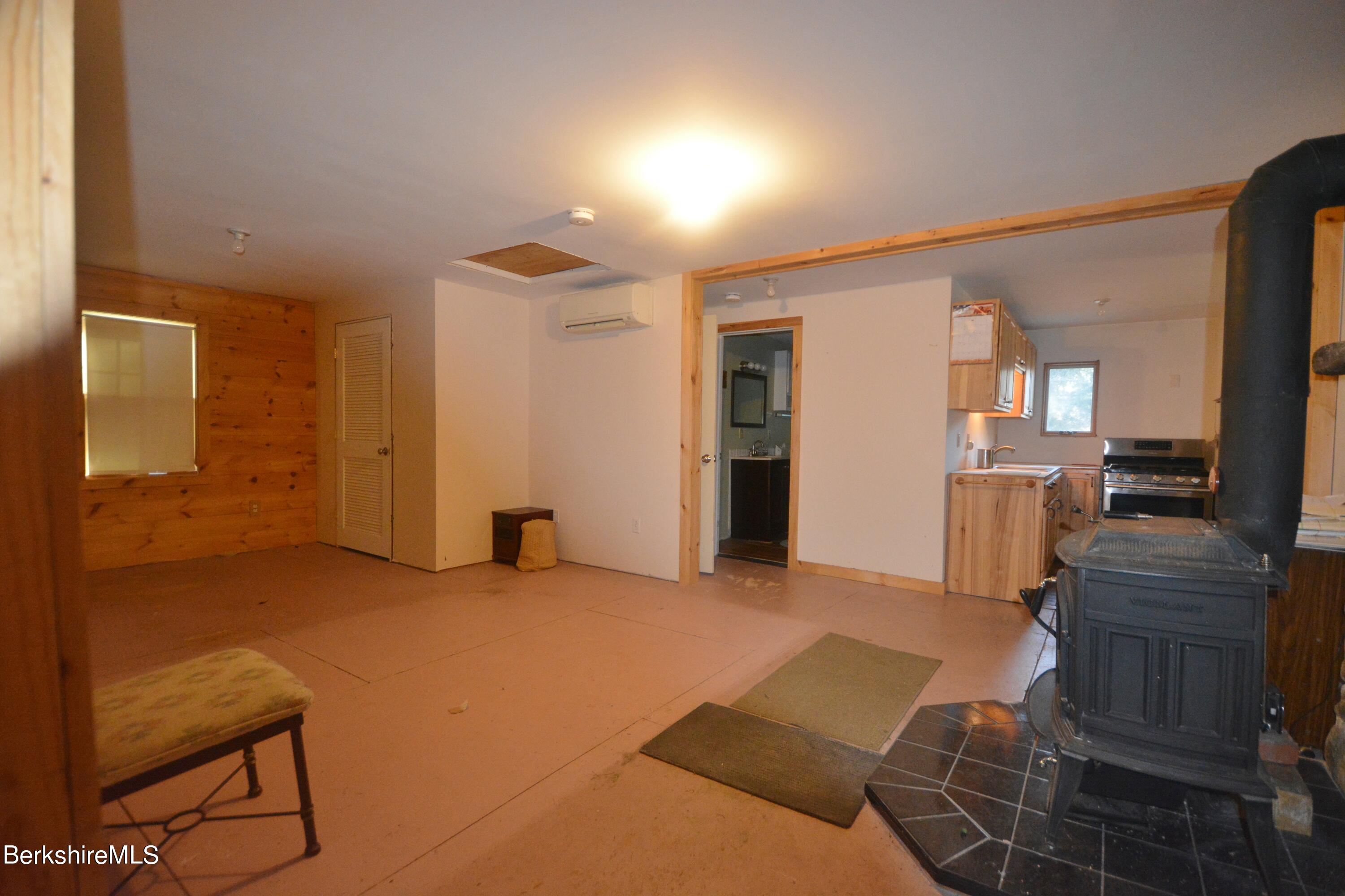 150 Cold Spring Road Sandisfield, MA 01255 - Photo 2 of 9 a view of a livingroom with furniture and a flat screen tv