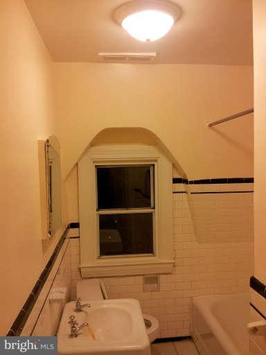 20 North Rosedale Street Baltimore, MD 21229 - Photo 14 of 15 a bathroom with a sink and a mirror