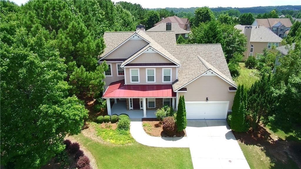 a view of house with yard entertaining space